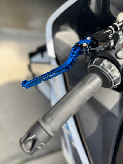 Close-up of a blue brake lever on a motorcycle handlebar.
